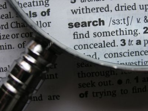 Magnifying glass to search Bibel study of words- a magnifying glass to search